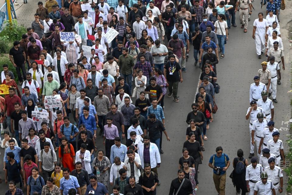 Medical professionals and students take part in a protest rally against the rape and murder of a doctor in Kolkata on 21 August 2024 (AFP via Getty Images)