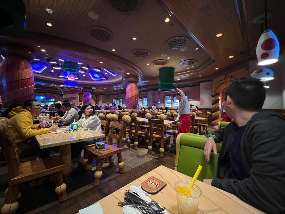 Guests at the Toadstool Cafe watch light show with a little entertainment as they wait for their food on March 2, 2023, at Universal Studios Hollywood.