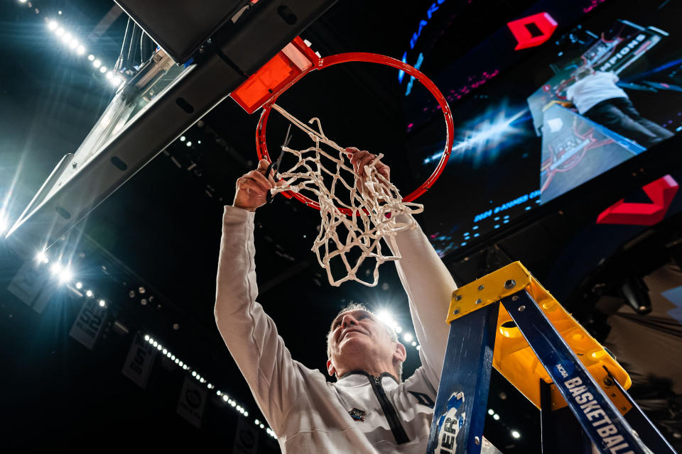 Duquesne head coach Keith Dambrot cuts the net after an NCAA college basketball game against Virginia Commonwealth in the championship of the Atlantic 10 Conference tournament Sunday, March 17, 2024, in New York. (AP Photo/Peter K. Afriyie)