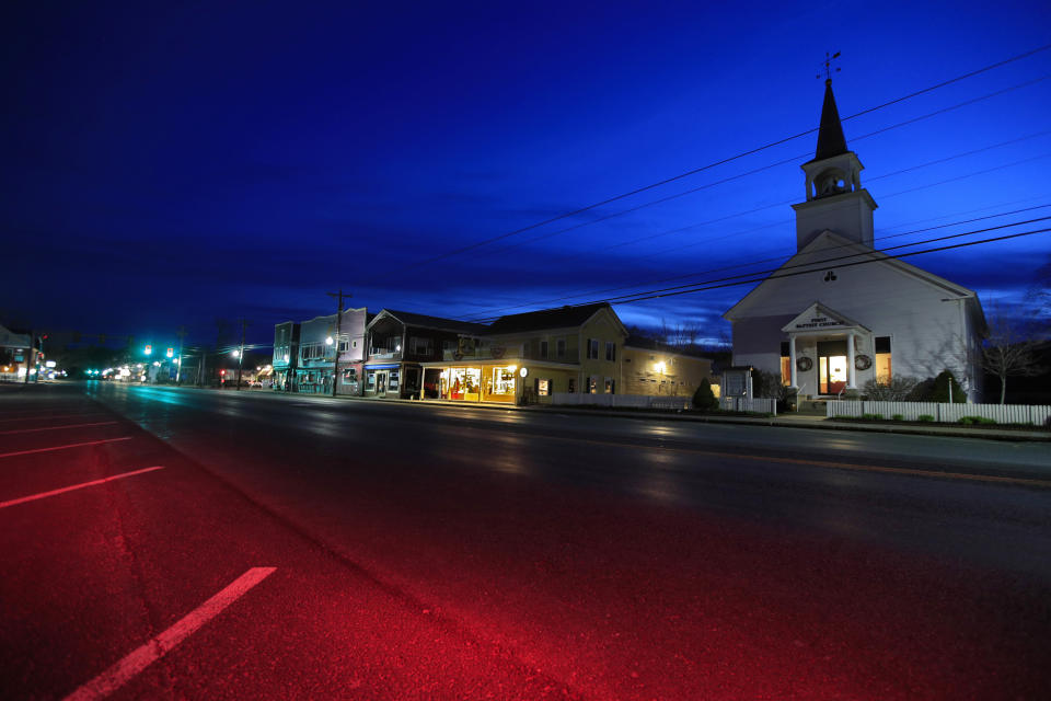 The First Baptist Church and small shops remain closed during the coronavirus pandemic, Sunday, April 26, 2020, in North Conway, N.H. (AP Photo/Robert F. Bukaty)
