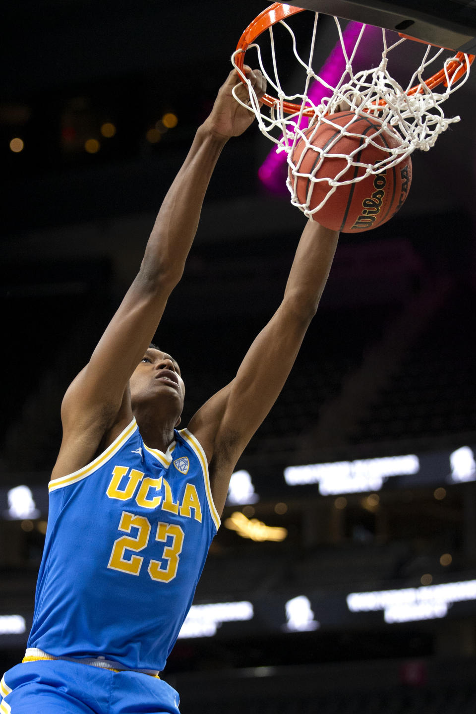 UCLA guard Peyton Watson dunks during the first half of the team's NCAA college basketball game against Bellarmine on Monday, Nov. 22, 2021, in Las Vegas. (AP Photo/Ellen Schmidt)