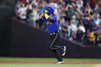 Seattle Mariners' Eugenio Suarez celebrates after hitting a home run against the Los Angeles Dodgers during the fourth inning of a baseball game Friday, Sept. 15, 2023, in Seattle. (AP Photo/Maddy Grassy)