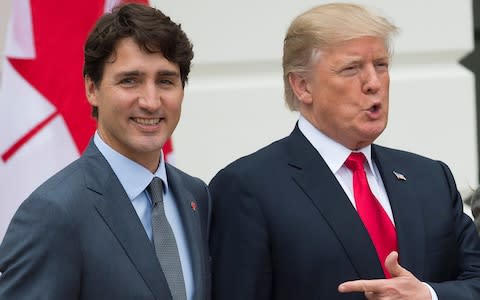 Donald Trump and Justin Trudeau talked by phone on Monday ahead of a fresh round of talks - Credit: AFP