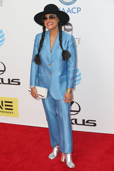 Cree Summer in a baby blue suit with metallic sliver booties, a black wide-brimmed hat, and her hair styled in braided pigtails at the 47th NAACP Image Awards at Pasadena Civic Auditorium in Pasadena, California.