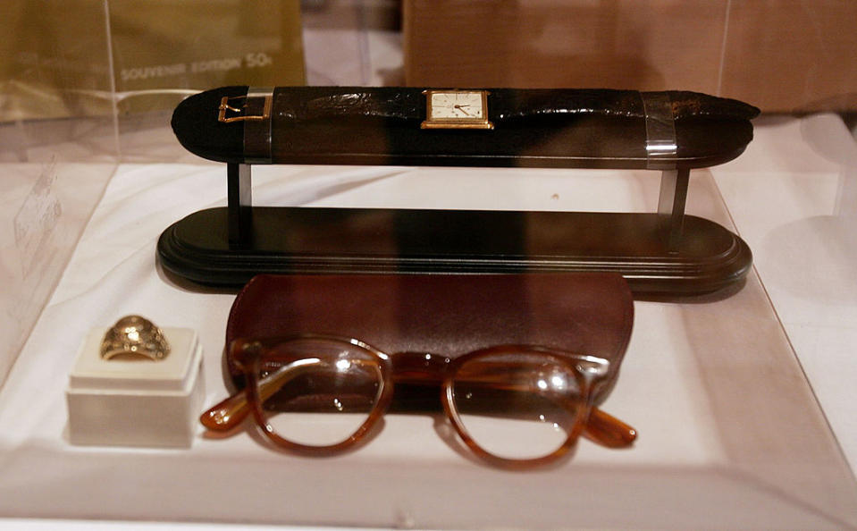 most expensive watches in the world, John F. Kennedy's Omega Ultra Thin Reference OT3980 dress watch., NEW YORK - NOVEMBER 16:  Items belonging to former U.S. President John F. Kennedy, including reading glasses and a Omega watch worn at his inauguration, lie on display at an auction preview at the Trump Tower November 16, 2005 in New York City. Part of the Robert White Collection, the items to be auctioned, which number into the thousands, cover a broad period of the late president's life. The auction will take place on December 13-17 at the 7th Regiment Armory in New York City.  (Photo by Spencer Platt/Getty Images)