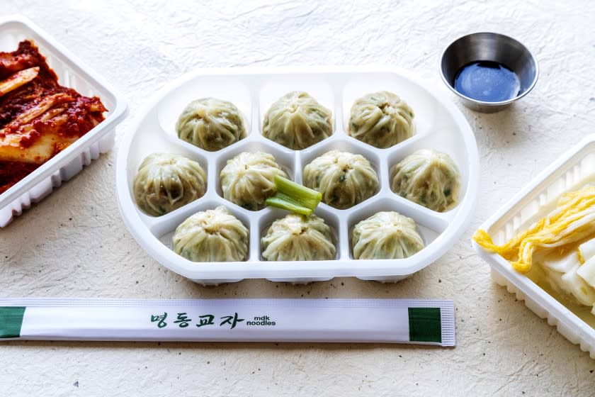 LOS ANGELES, CA - DECEMBER 09, 2020 - Pick up order - Saeoo Mandoo - Shrimp and Pork Dumplings, Rt, with soy sauce and Bachan at MDK Noodles in Koreatown.