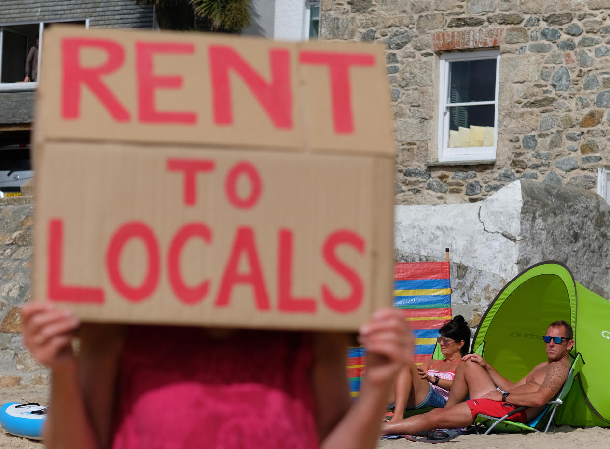 First Homes Not Second Homes protest on the 11th of September 2021 in St Ives, Cornwall, United Kingdom. First NOT Second Homes (FNSH) launched the campaign today with an action which seeks to involve other communities across the UK to bring about a lasting and meaningful change in the housing crisis. There is no housing shortage, but there is a housing distribution crisis. The protesters live in various locations in the far Southwest of the county, and recognise that the Southwest is the worst affected area for second home ownership and its detrimental effects when they are used solely for holiday lets and through AirBnB. Much of the profit from these properties leaves the host communities and does little to support the local economy. (photo by Gav Goulder/In Pictures via Getty Images)