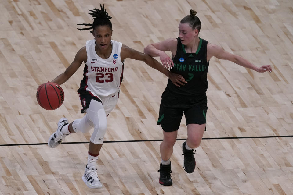 Stanford guard Kiana Williams drives under pressure from Utah Valley guard Maria Carvalho (3) during the second half of a college basketball game in the first round of the women's NCAA tournament at the Alamodome in San Antonio, Sunday, March 21, 2021. (AP Photo/Charlie Riedel)