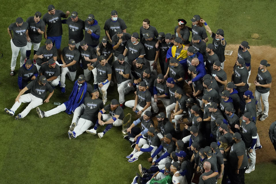 Los Angeles Dodgers pose for a group picture after defeating the Tampa Bay Rays 3-1 to win the baseball World Series in Game 6 Tuesday, Oct. 27, 2020, in Arlington, Texas. (AP Photo/David J. Phillip)