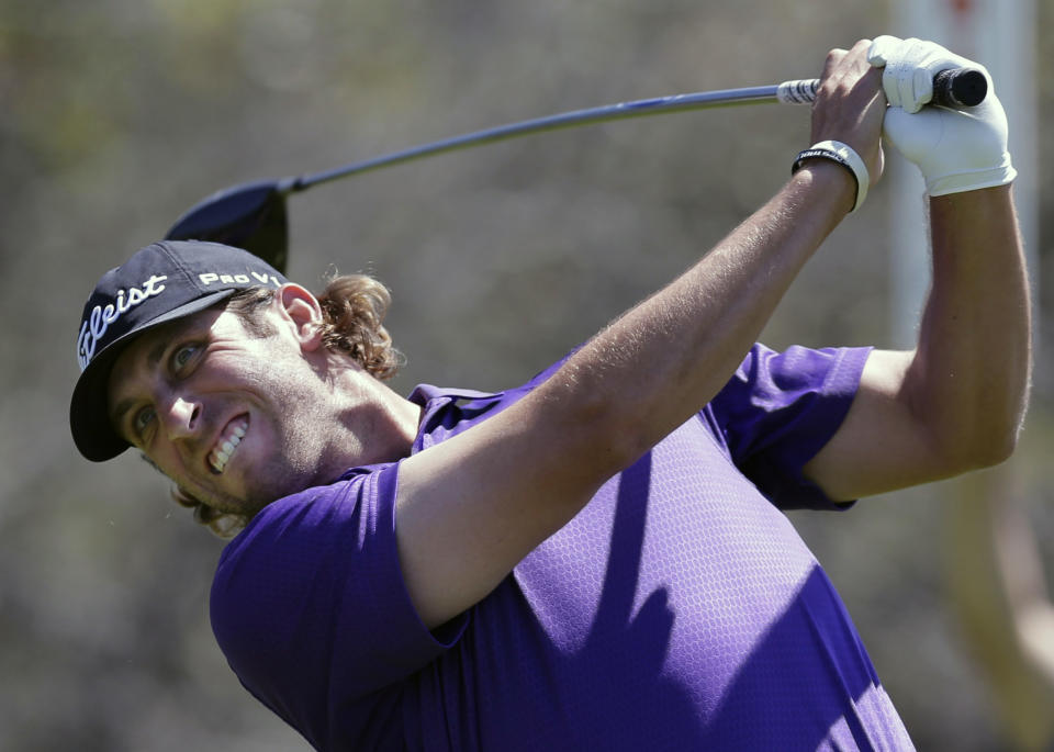 Andrew Loupe hits his drive on the ninth hole during the final round of the Texas Open golf tournament on Sunday, March 30, 2014, in San Antonio. (AP Photo/Eric Gay)