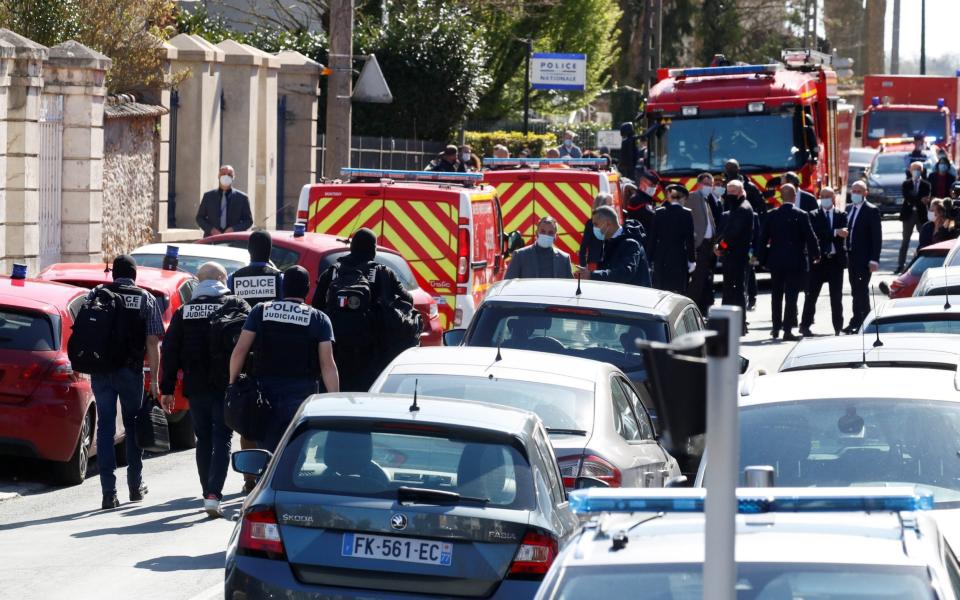 Police officers secure the area where an attacker stabbed a female police administrative worker, in Rambouillet - GONZALO FUENTES /REUTERS