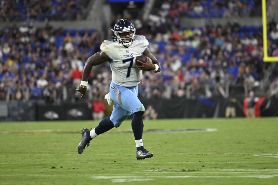 Tennessee Titans quarterback Malik Willis runs with the ball before scoring a touchdown against the Baltimore Ravens during the first half of a preseason NFL football game, Thursday, Aug. 11, 2022, in Baltimore. (AP Photo/Gail Burton)