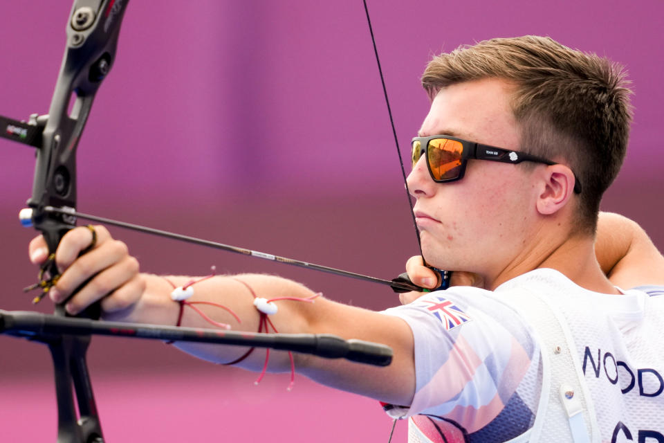 Olympic debutant Woodgate, 19, navigated his way to the last 64 but was unable to hit the target against Kazakh archer Ilfat Abdullin