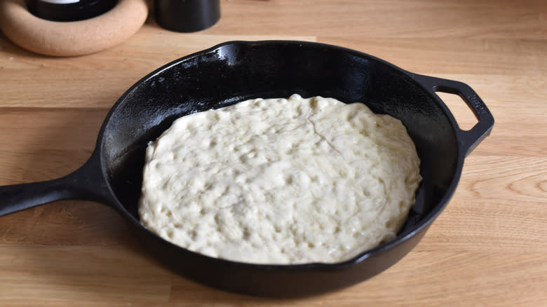 pizza dough in cast iron pan