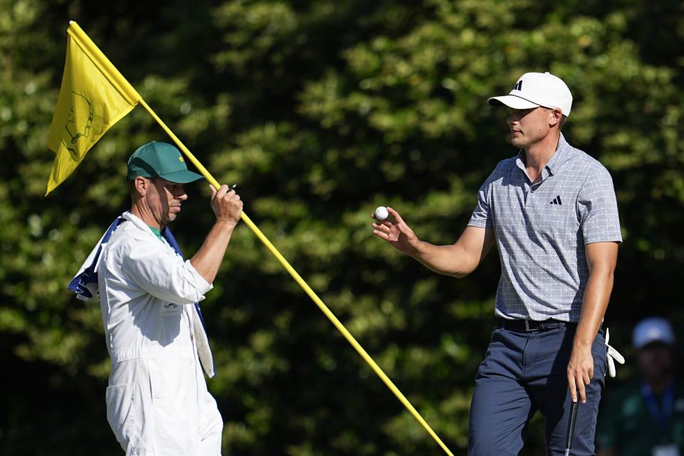 Ludvig Aberg, of Sweden, waves after making a putt on the 11th hole during final round at the Masters golf tournament at Augusta National Golf Club Sunday, April 14, 2024, in Augusta, Ga. (AP Photo/George Walker IV)