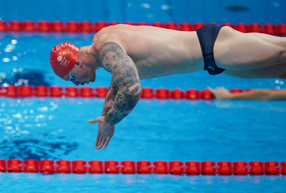 Britain's biggest gold medal hope, Adam Peaty, dives into the pool during a training session (PA Wire)