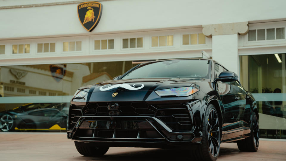 A Lamborghini Urus wears a decal of a moustache, the symbol of Movember and raising awareness for men's health issues.