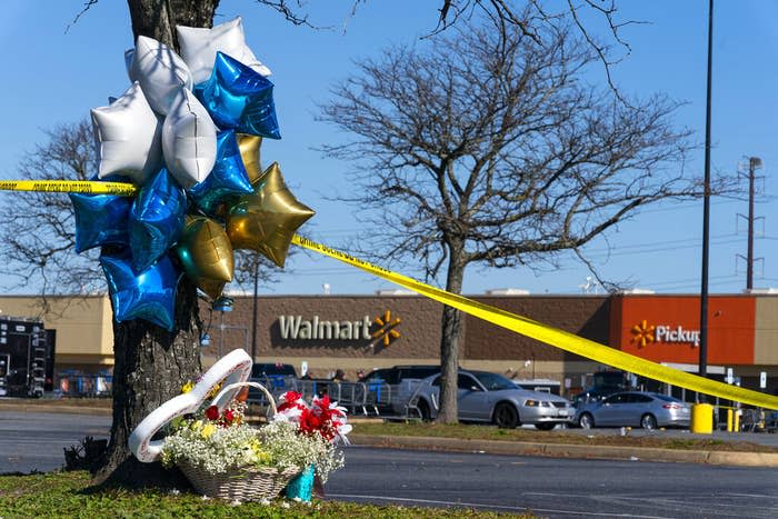 Flowers and balloons have been placed near the scene of a mass shooting at a Walmart on Nov. 23, 2022, in Chesapeake, Virginia.