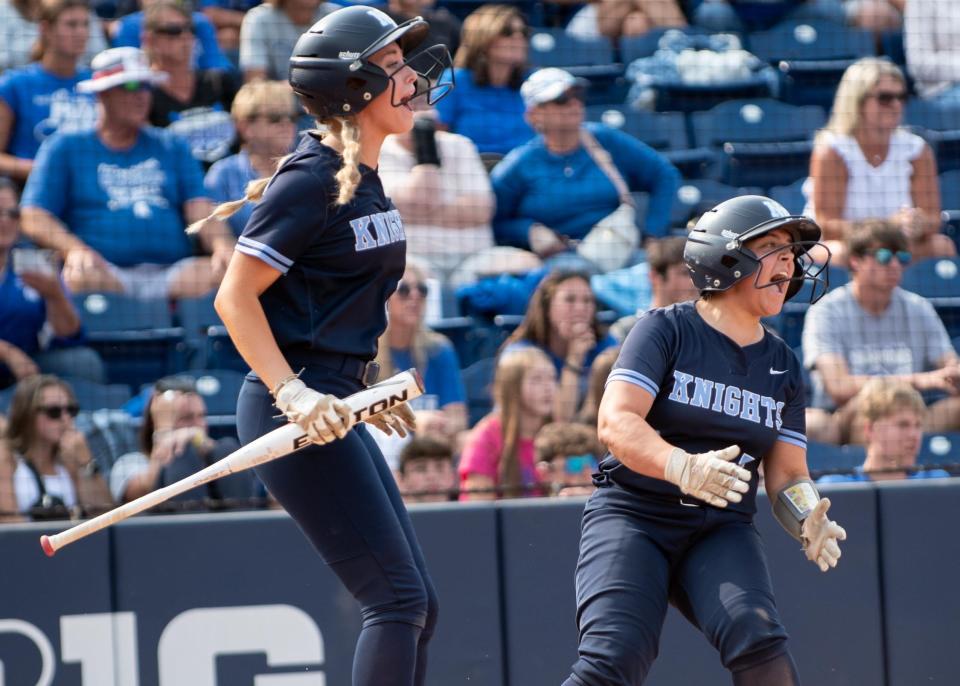 North Penn's Bella Nunn, left, and Gianna Cimino celebrate a run in the PIAA 6A championship softball game against Hempfield at Penn State University in State College on Thursday, June 15, 2023. The Knights captured the title with a 1-0 win over the Spartans.