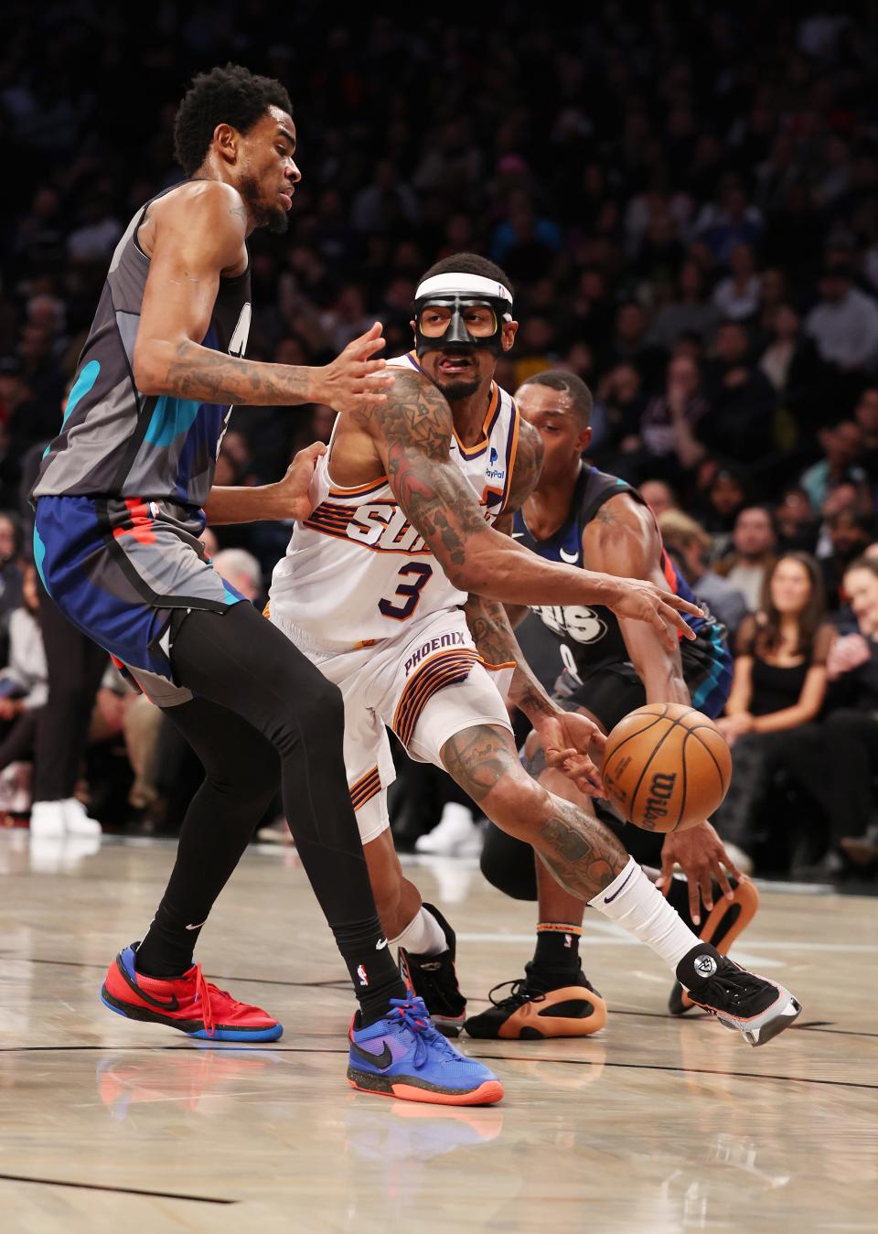 Bradley Beal #3 of the Phoenix Suns drives against Nic Claxton #33 of the Brooklyn Nets during their game at Barclays Center on Jan. 31, 2024 in New York City.