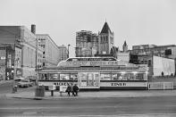 <p>In 1939, Roland Stickney came up with a diner design <a href="https://murphysdiner.com/a-brief-history-of-diners/" rel="nofollow noopener" target="_blank" data-ylk="slk:inspired by Art Deco and trains;elm:context_link;itc:0;sec:content-canvas" class="link ">inspired by Art Deco and trains</a>. He came up with a diner that was shaped like a streamlined train with a long counter, casual atmosphere, and fast American food. That's the look that Mickey's Diner (pictured here) in downtown St. Paul had. </p>