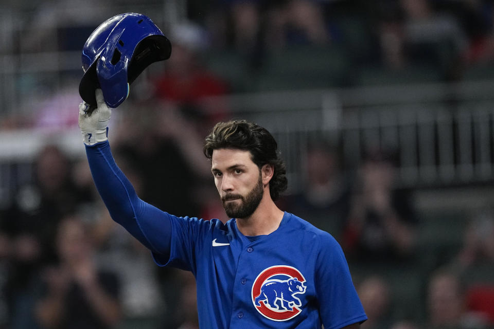 Chicago Cubs' Dansby Swanson waves to the crowd before batting against his former team the Atlanta Braves in the second inning of a baseball game, Tuesday, Sept. 26, 2023, in Atlanta. (AP Photo/John Bazemore)