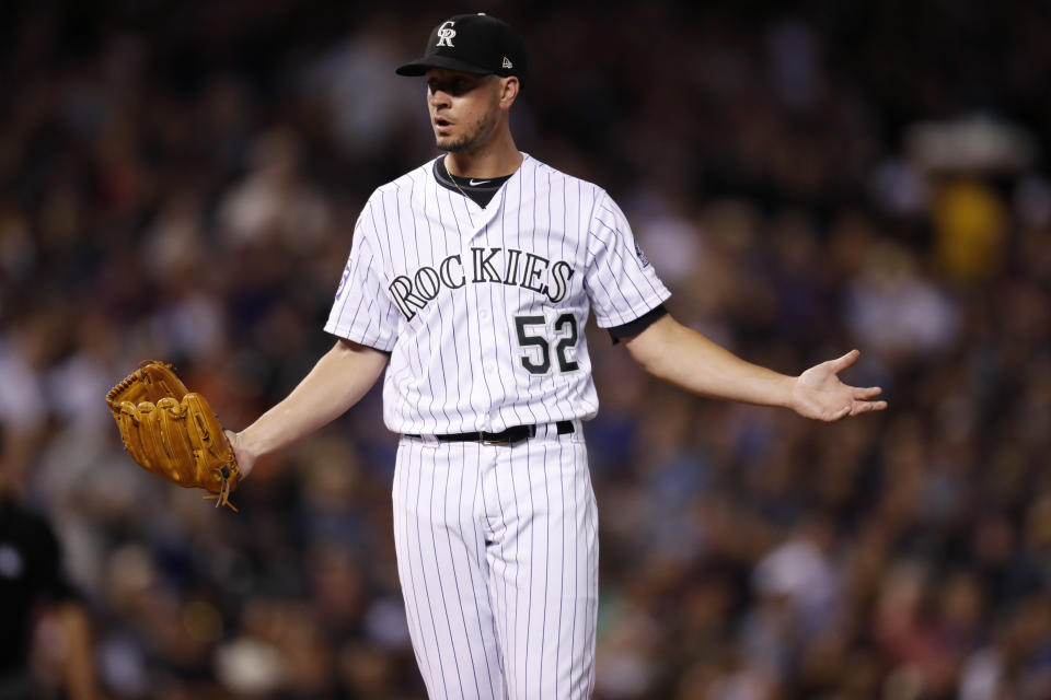 Colorado Rockies relief pitcher Chris Rusin reacts after being called for a balk in the fifth inning of a baseball game against the Los Angeles Dodgers Friday, Sept. 7, 2018, in Denver. (AP Photo/David Zalubowski)