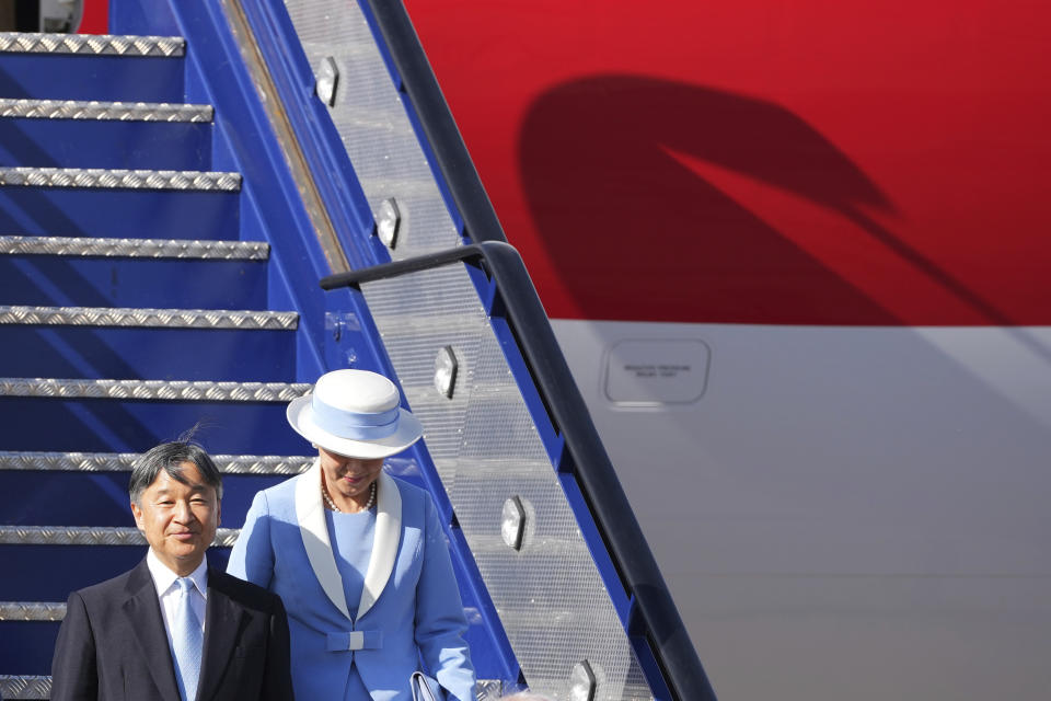 Emperor Naruhito and Empress Masako disembark their aircraft as they arrive at Stansted Airport, England, Saturday, June 22, 2024, ahead of a state visit. The state visit begins Tuesday, when King Charles III and Queen Camilla will formally welcome the Emperor and Empress before taking a ceremonial carriage ride to Buckingham Palace. (AP Photo/Kin Cheung)