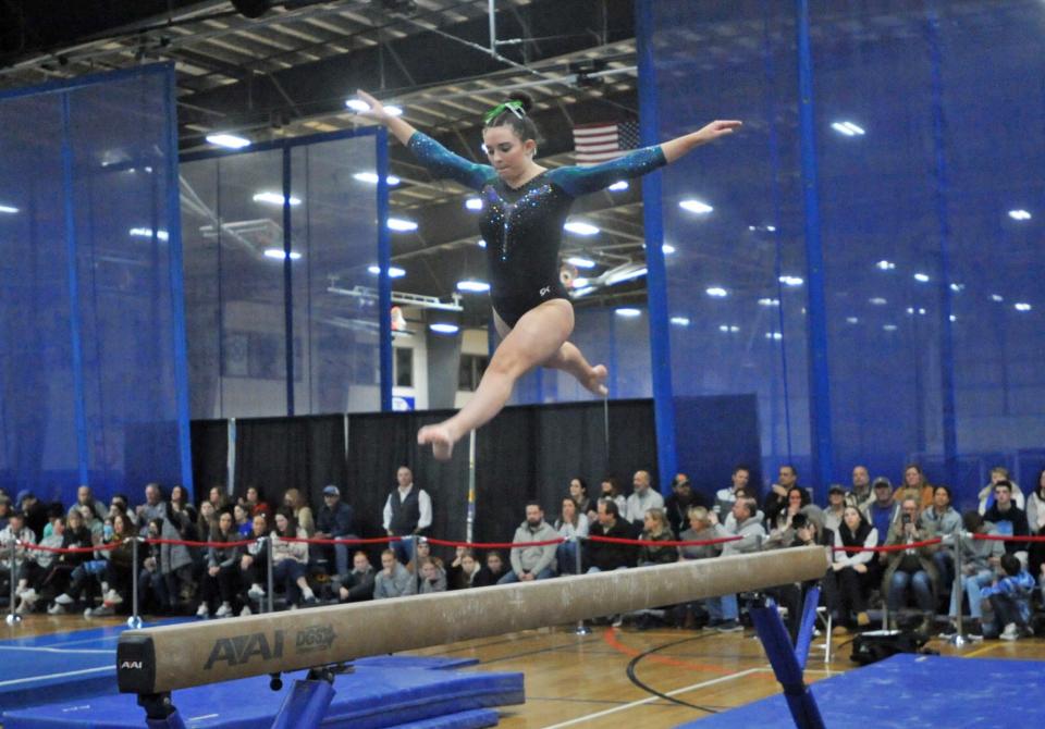 Marshfield's Annie Spencer performs on the balance beam during the Patriot League gymnastics meet at Starland in Hanover, Friday, Feb. 9, 2024.