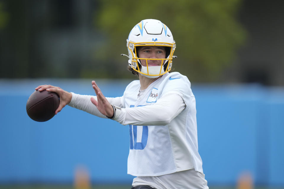 Los Angeles Chargers quarterback Justin Herbert (10) runs a drill during the NFL football team's camp in Costa Mesa, Calif., Wednesday, June 14, 2023. (AP Photo/Jae C. Hong)
