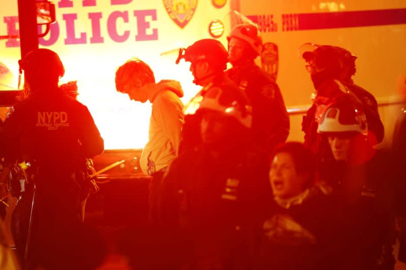 NYPD police officers remove and arrest Pro-Palestine protesters who occupied the Hamilton Hall building the campus at Columbia University in New York City late on Tuesday. Photo by John Angelillo/UPI