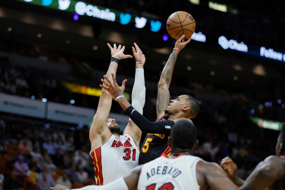 April 11 play-in game: The Atlanta Hawks' Dejounte Murray (5) shoots the ball over the Miami Heat's Max Strus (31) during the first quarter at Kaseya Center. The Hawks won the game, 116-105.