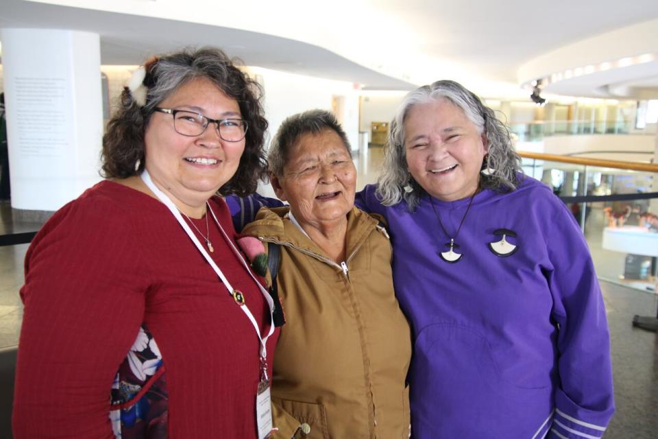 From left to right: Barbara Sevigny embraces her mom, Sarah Birmingham and sister Elisapee Sheutiapik after the release of the final report of the National Inquiry into Missing and Murdered Indigenous Women and Girls in Gatineau, Que.