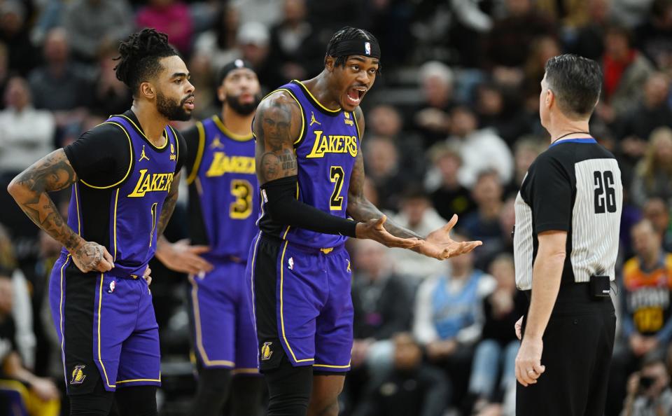 Los Angeles Lakers guard D’Angelo Russell (1) and Los Angeles Lakers forward Jarred Vanderbilt (2) argue with referee Pat Fraher (26) as Utah and Los Angeles play at the Delta Center in Salt Lake City on Saturday, Jan. 13, 2024. | Scott G Winterton, Deseret News