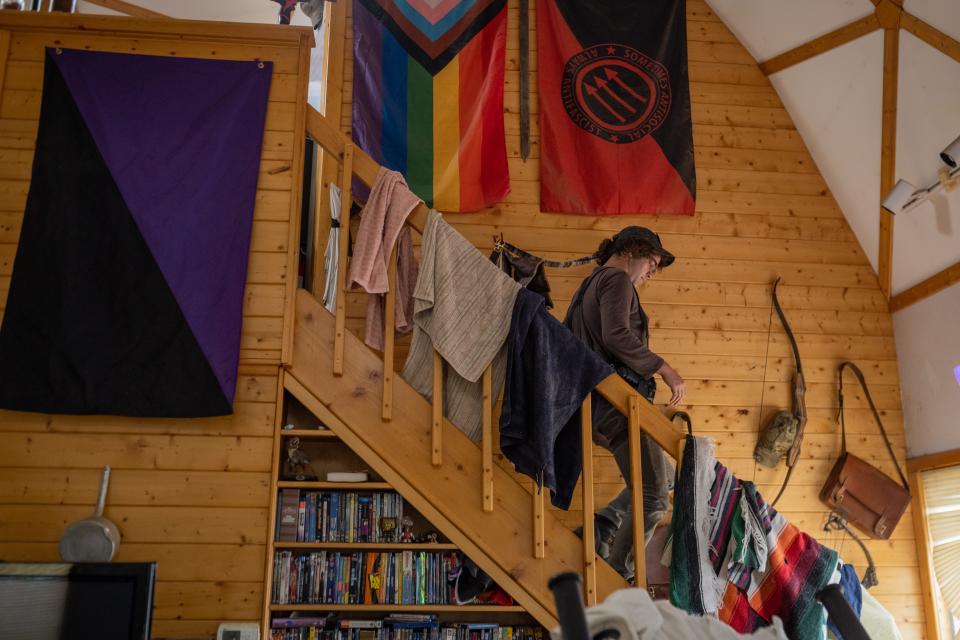 J Stanley walks down the stairs of the ranch house.