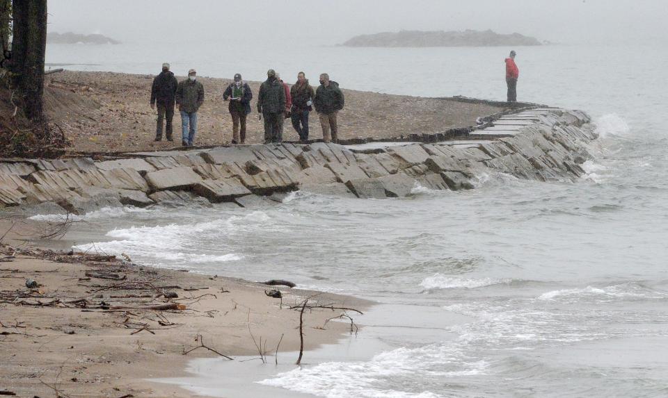 U.S. Army Corps of Engineers and Pennsylvania Department of Conservation & Natural Resources personnel conduct the 2020 fall beach walk at Presque Isle State Park. The 2023 walk took place Wednesday.
