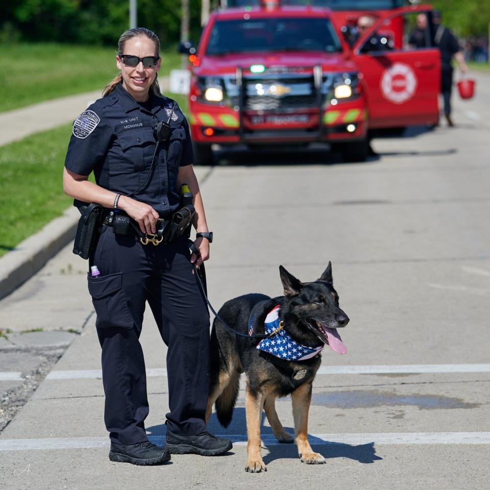 Detective Holly McManus of the St. Francis Police Department is pictured with K9 Bane. Bane retired in October 2020.