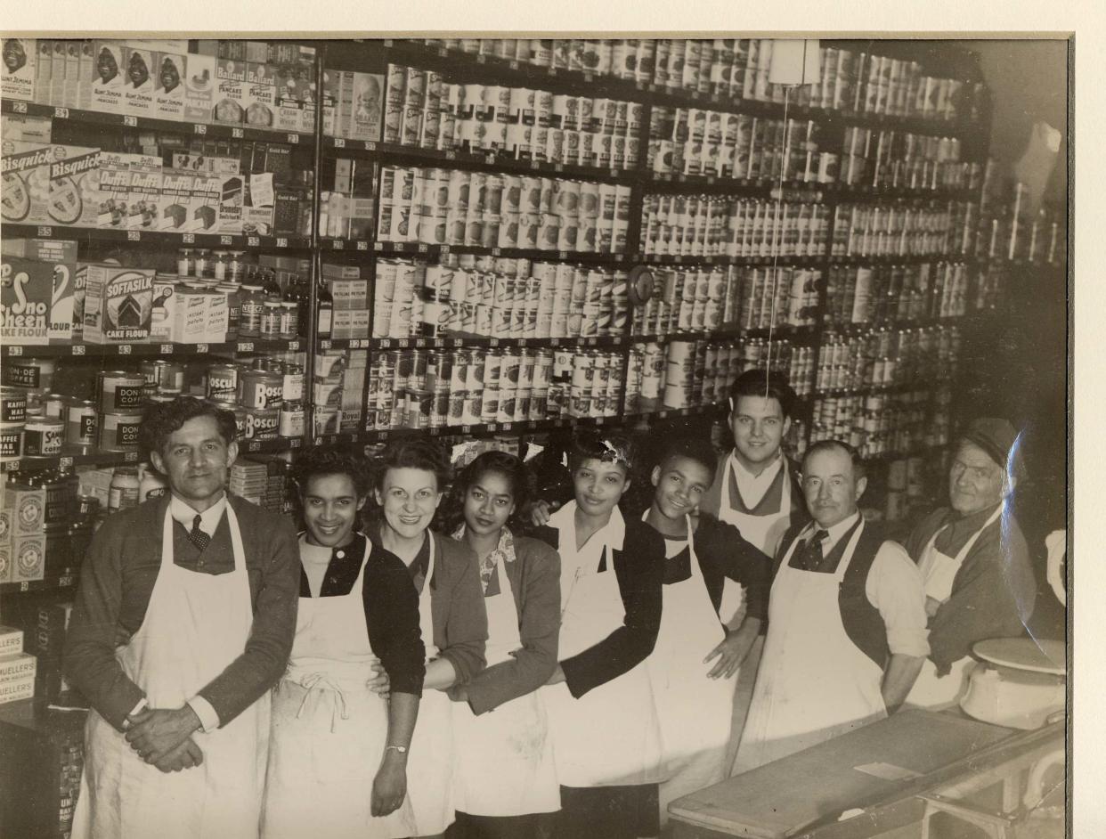 Part of the history of the downtown section Canton is shown in this Taylor Matthews photograph of staff at Strausser Grocery Store on Cherry Avenue. C. Strausser is shown on the far left.