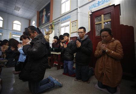 Believers take part in a weekend mass at an underground Catholic church in Tianjin November 10, 2013. Picture taken November 10, 2013. REUTERS/Kim Kyung-Hoon