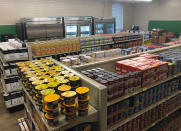 In this photo provided by Anthony Love, food and toiletries line the shelves of Linda Tutt High School's student-led grocery store on Nov. 20, 2020, in Sanger, Texas. (Anthony Love via AP)