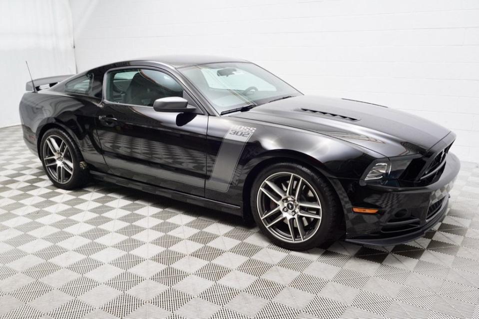 <p>With the Bullitt Mustang headed out of Ford's lineup and Mach 1 on the way back in, we're reminded of the Boss 302. Here's a more specific version: <a href="https://www.autoblog.com/cars-for-sale-detail-1724907336855984181-Ford-Mustang-2013" data-ylk="slk:a 2013 Boss 302 Laguna Seca;elm:context_link;itc:0;sec:content-canvas" class="link ">a 2013 Boss 302 Laguna Seca</a>. </p> <p>The more track-ready version of the Boss 302 had a limited run of 750 cars, in 2012 and 2013. Its 302/5.0-liter V8 put out 444 horsepower (up 32 from the stock Mustang GT that year) and 380 pound-feet of torque with a 7,500-rpm redline, and it put down a 4-second 0-60 time. It had Recaro seats; Torsen limited-slip differential; track-tuned suspension with higher spring rates and manually adjustable dampers; aggressive front splitter and bigger rear spoiler; a larger rear stabilizer; and a big tubular crossbar brace that replaced the rear seat and added 10 percent more rigidity. It's street-legal, unlike the track-only Boss 302R and 302S.</p> <p>Hagerty prices the Laguna Seca up to $42K for an excellent example. The ask for this one is $38K. It has a mere 2,105 miles on the odometer. And though the paint job on the 2012 Laguna Seca was garish, with a lot of red stripes and a red roof, in 2013 they toned it down to this classy black and silver.</p> <p>So for the price of a new or even used Mustang GT, you can daily-drive something a bit more baller. Just don't expect to put the kids in the back seat. <strong>— Managing Editor Greg Rasa</strong></p>