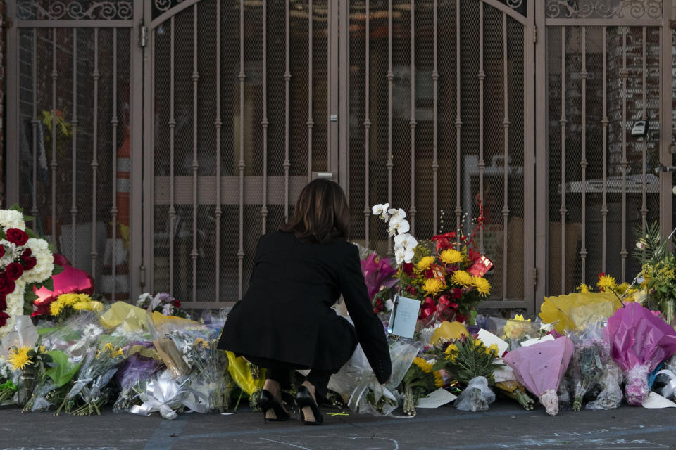 Vice President Kamala Harris lays flowers at a memorial set up outside Star Dance Studio in Monterey Park, Calif., Wednesday, Jan. 25, 2023, to honor the victims killed in last week's mass shooting. (AP Photo/Jae C. Hong)