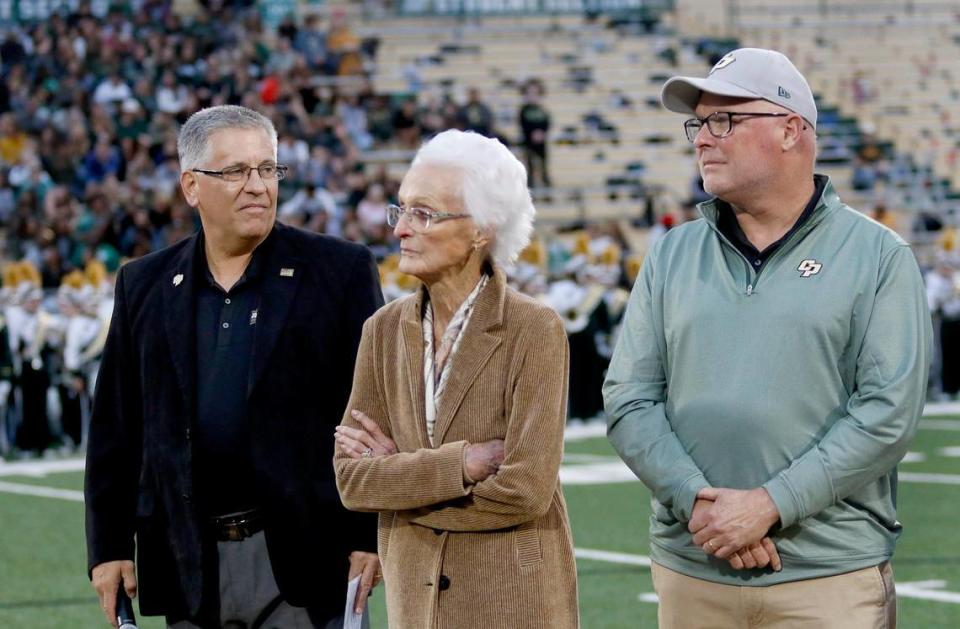 Cal Poly President Jeffrey Armstrong, left, announces plans for John Madden Football Center at the Mustangs’ game on Oct. 1, 2022, along with Virginia Madden, John Madden’s wife and a Cal Poly alumna, and her son Mike Madden.