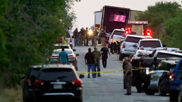 PHOTO: Police and other first responders work the scene where dozens of people were found dead and multiple others were taken to hospitals after a tractor-trailer containing suspected migrants was found on June 27, 2022, in San Antonio. (Eric Gay/AP, FILE)