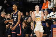 Marquette's Jordan King (23) claps in front of UConn's Aubrey Griffin (44) during the second half of an NCAA college basketball game Wednesday, Feb. 8, 2023, in Milwaukee. (AP Photo/Aaron Gash)