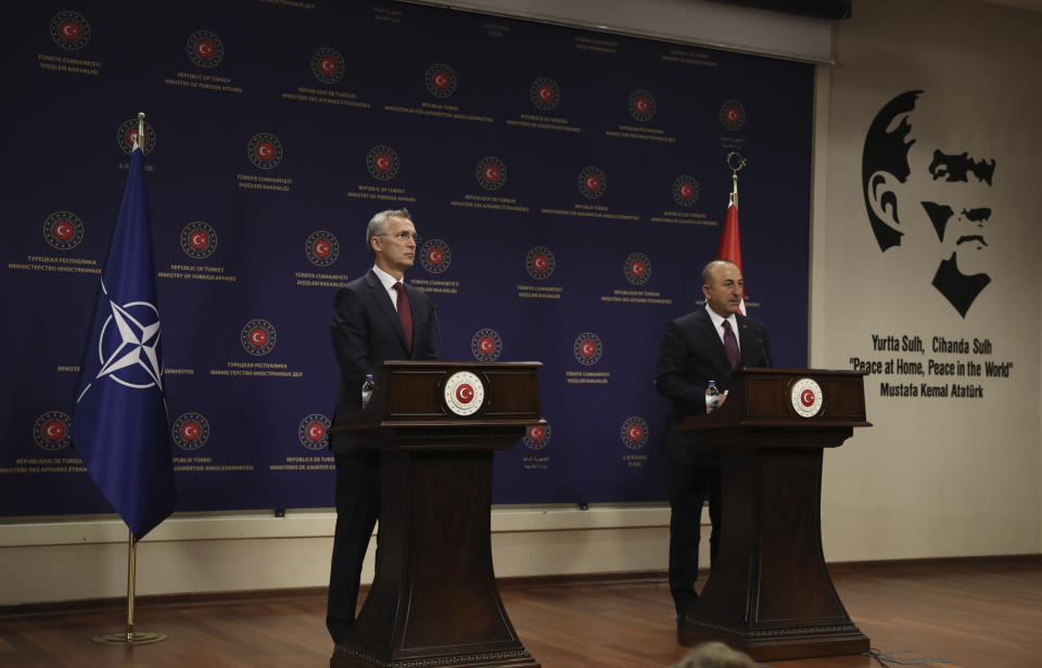 NATO Secretary-General Jens Stoltenberg, left, and Turkey's Foreign Minister Mevlut Cavusoglu speak to the media after their talks in Ankara, Turkey, Monday, Oct. 5, 2020. Stoltenberg said the 30-country military alliance is "deeply concerned by the escalation of hostilities " between Azerbaijan and Armenia and he urged Turkey to help end the fighting. (AP Photo/Burhan Ozbilici)