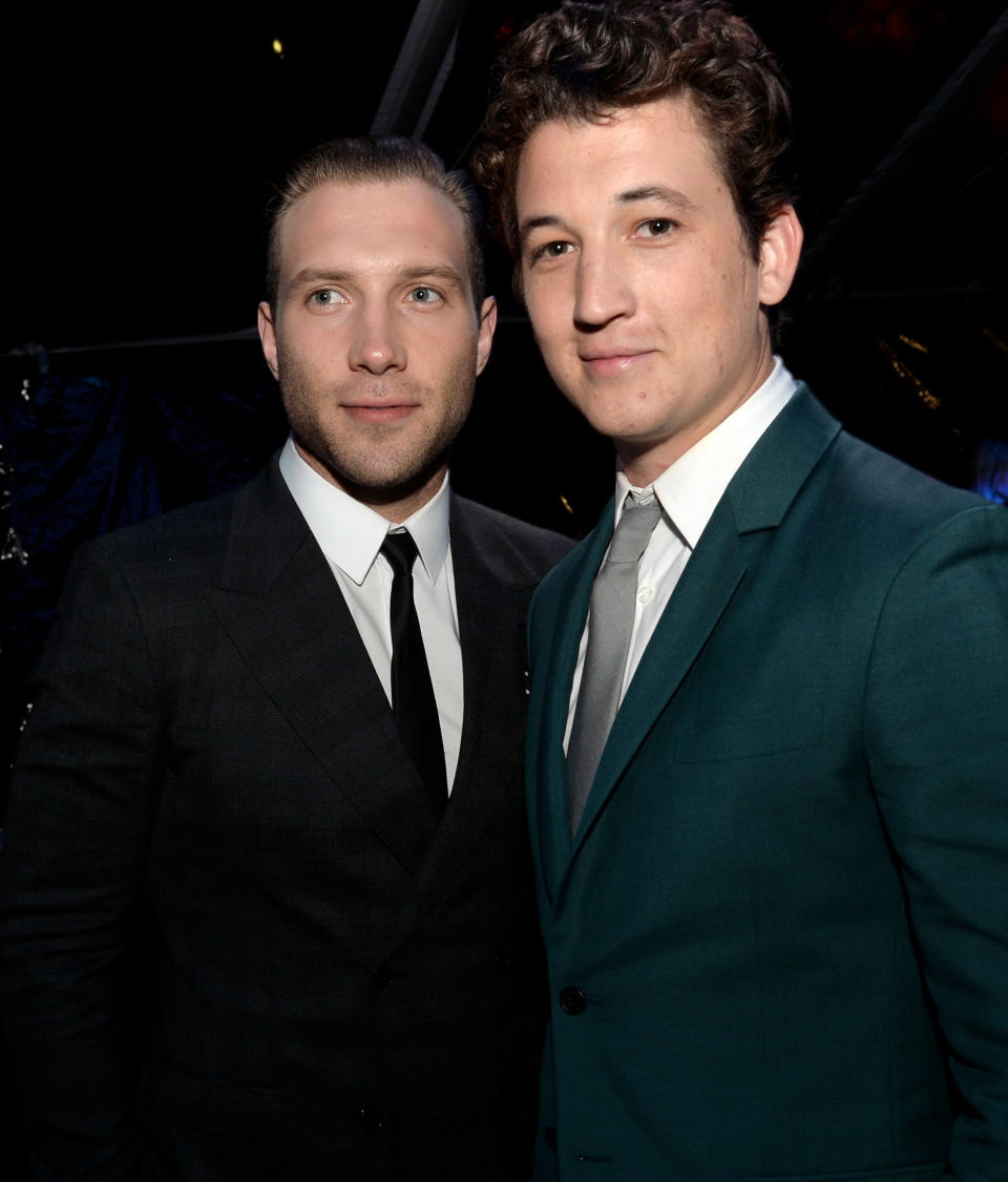 LOS ANGELES, CA - MARCH 18:  Actors Jai Courtney (L) and Miles Teller pose at the after party for the premiere of Summit Entertainment's 'Divergent' at The Armand Hammer Museum on March 18, 2014 in Los Angeles, California.  (Photo by Kevin Winter/Getty Images)