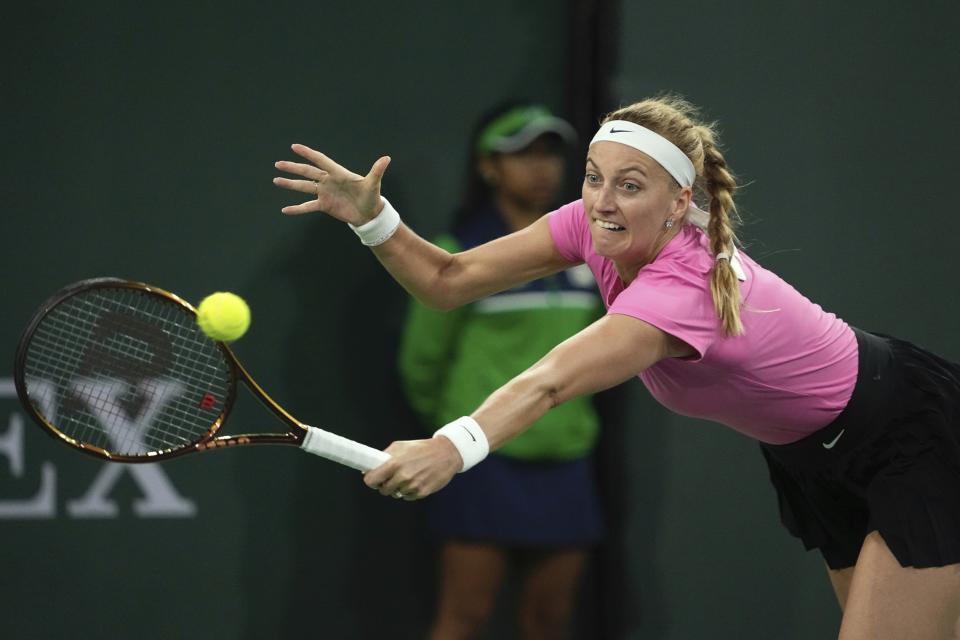 Petra Kvitova, of the Czech Republic, returns a shot to Maria Sakkari, of Greece, at the BNP Paribas Open tennis tournament Wednesday, March 15, 2023, in Indian Wells, Calif. (AP Photo/Mark J. Terrill)