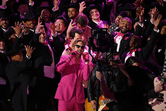 <p>PATRICK T. FALLON/AFP via Getty</p> Ryan Gosling performs 'I'm Just Ken' at the 2024 Oscars