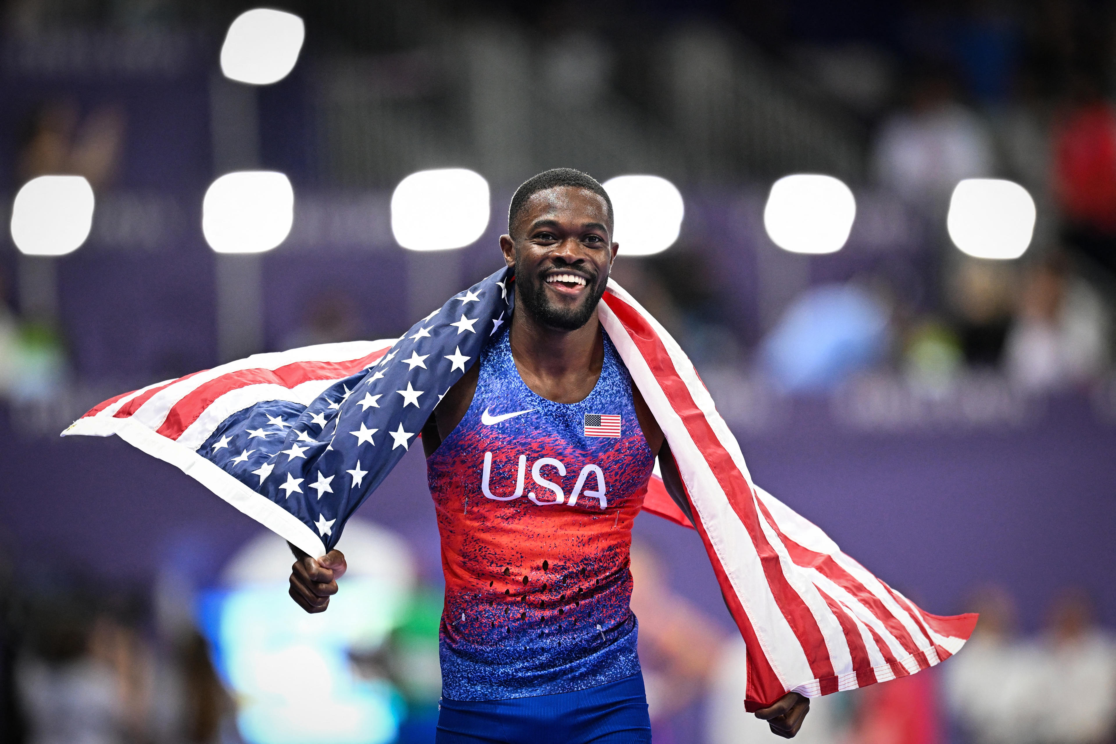 Rai Benjamin of the United States celebrates after winning the final of the men's 400 metres hurdles at the Paris 2024 Olympic Games at the Stade de France in Saint-Denis, north of Paris, August 9, 2024. (Kirill Kudryavtsev/AFP/Getty Images)